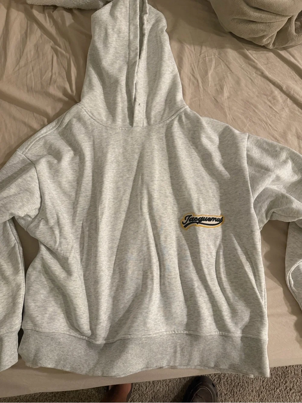 Jacquemus Light Gray Hoodie with Black and Yellow Logo